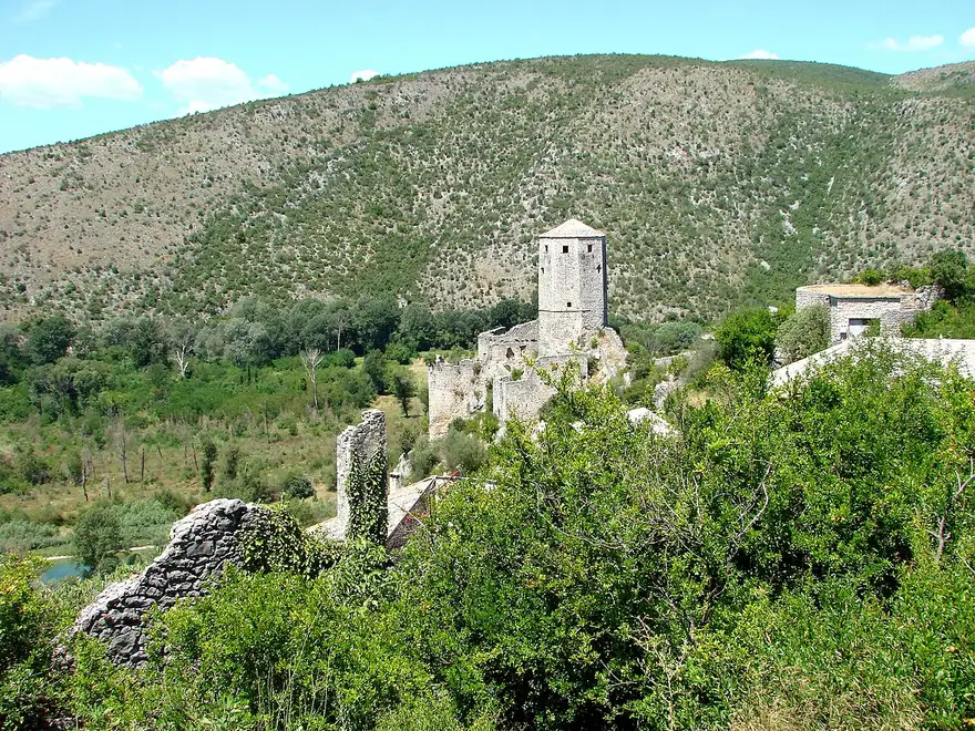 The Ottoman stone houses and hilltop fortress tower of Počitelj climbing above the Neretva valley in Herzegovina