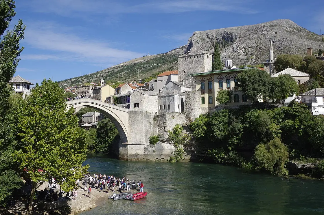 The Ottoman stone arch of the Old Bridge (Stari Most) over the green Neretva river in Mostar