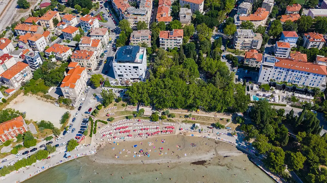 Bačvice sandy bay with swimmers and the Split skyline behind
