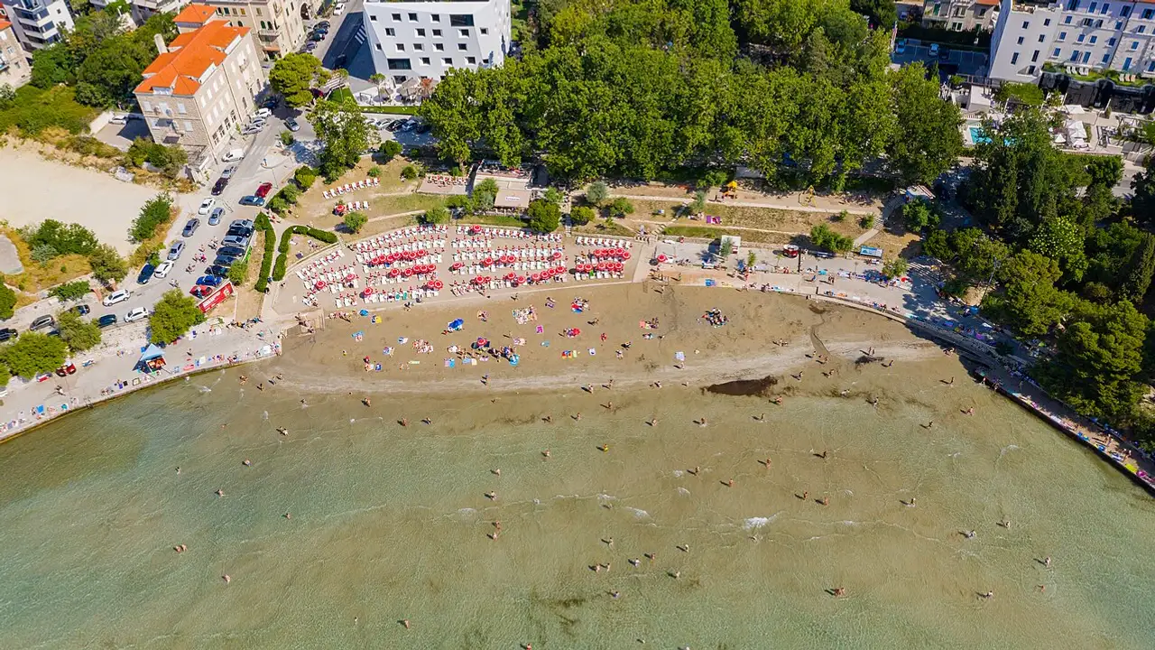 Aerial view of the sandy Bačvice bay with Split harbour and the old town behind