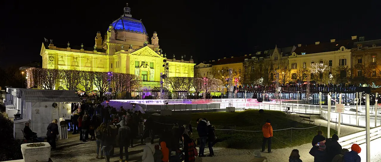 Advent Christmas market in Zagreb at night with an ice rink and festive lights
