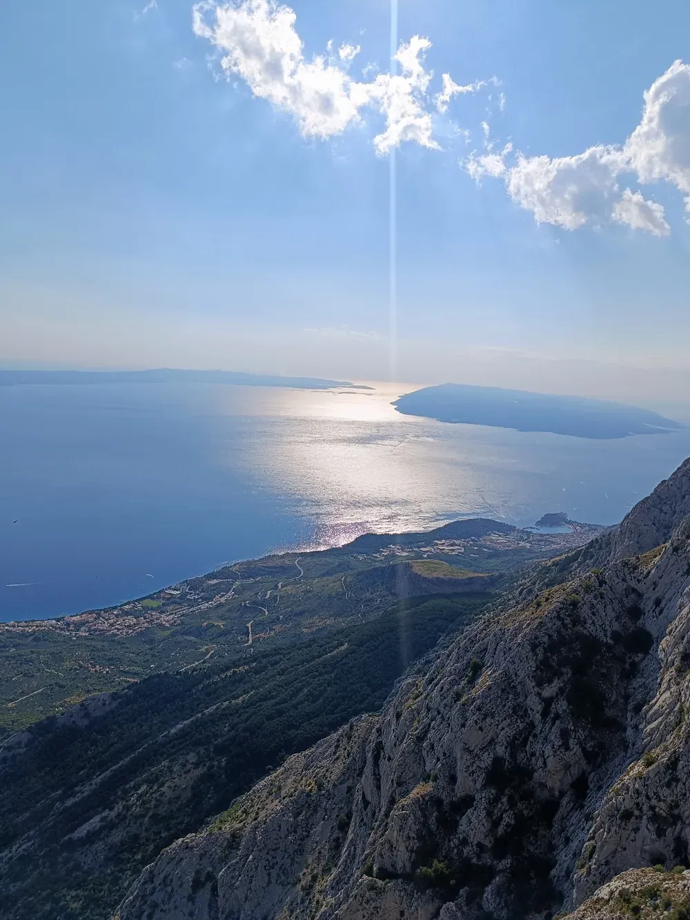 The view straight down from high on Biokovo over Makarska and the Adriatic toward the islands at midday