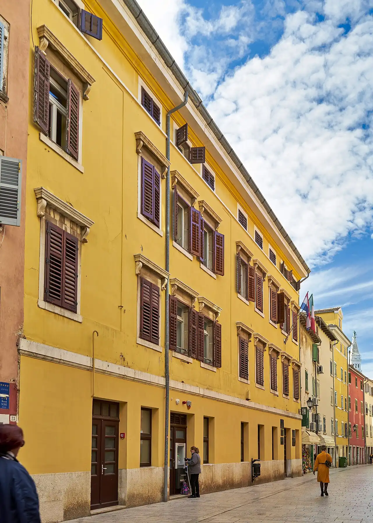 A narrow street with old houses in Rovinj old town