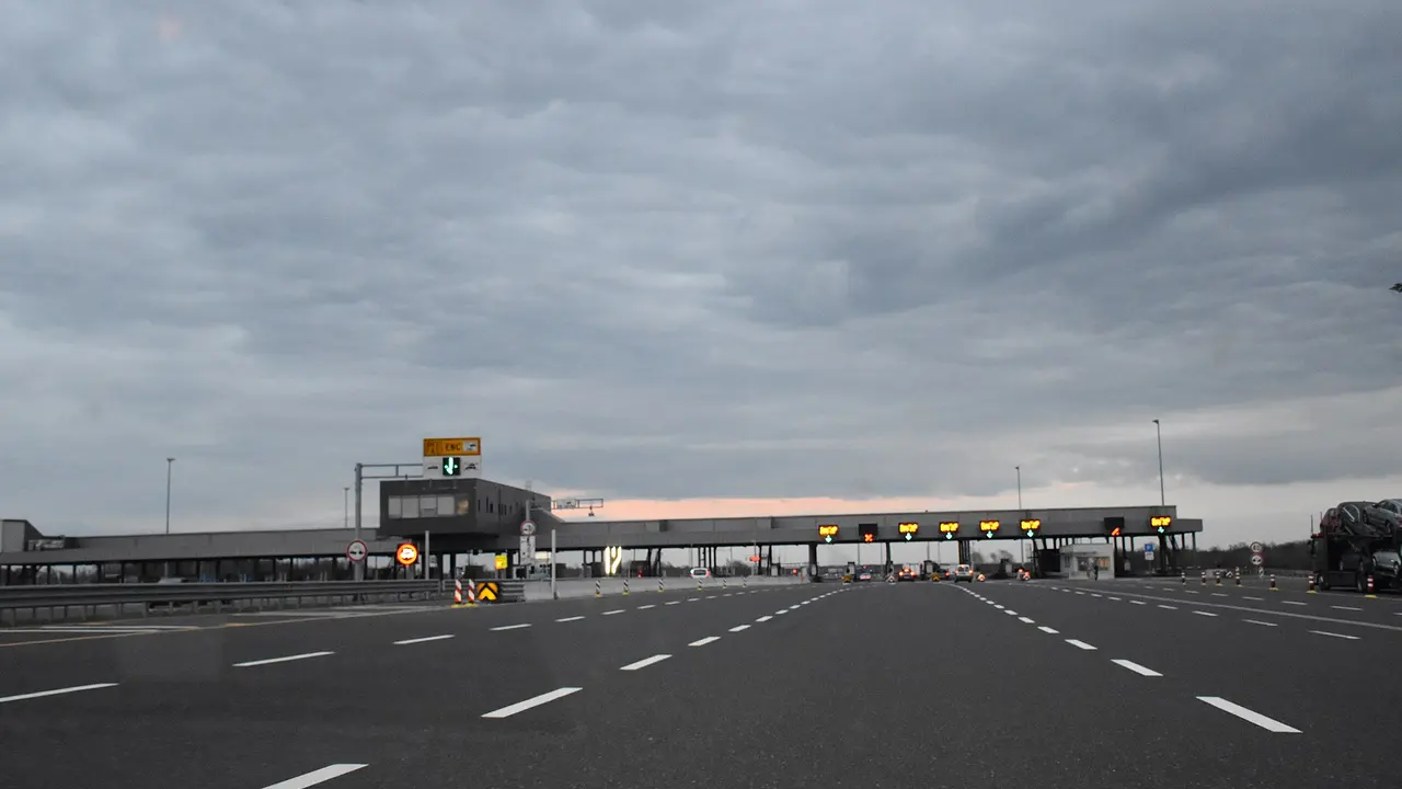 Ivanja Reka toll plaza on the motorway out of Zagreb, with separate ENC and ticket-and-barrier lanes, seen from inside a car