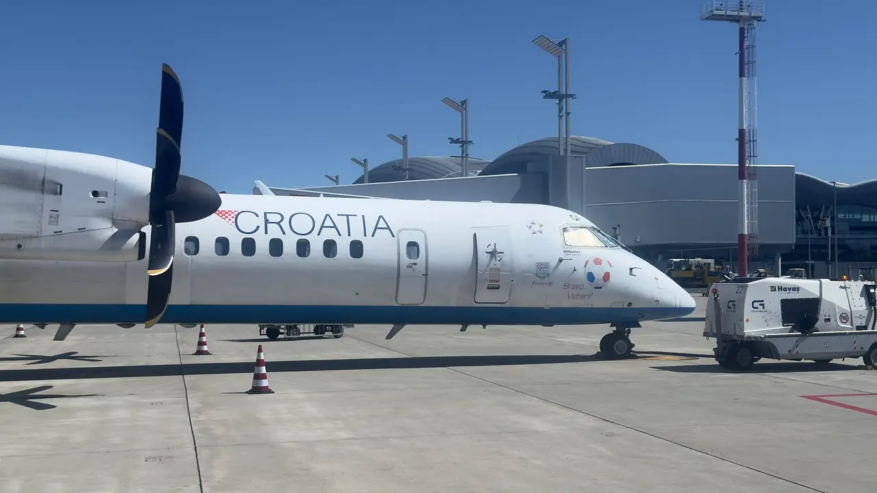 Croatia Airlines Dash 8 on the apron at Zagreb Airport under a clear sky