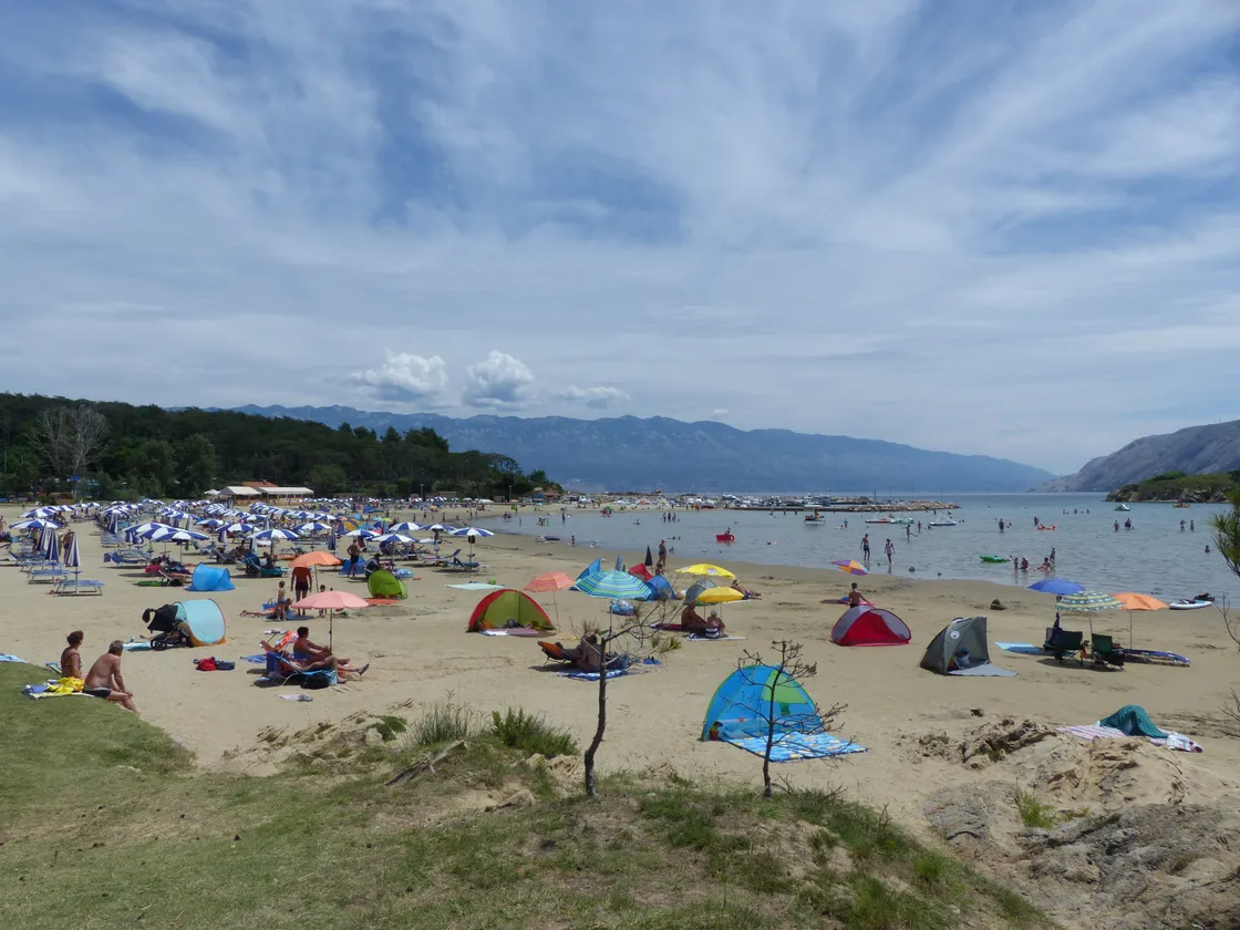 The shallow, sandy Paradise Beach at Lopar on the island of Rab, with clear turquoise water