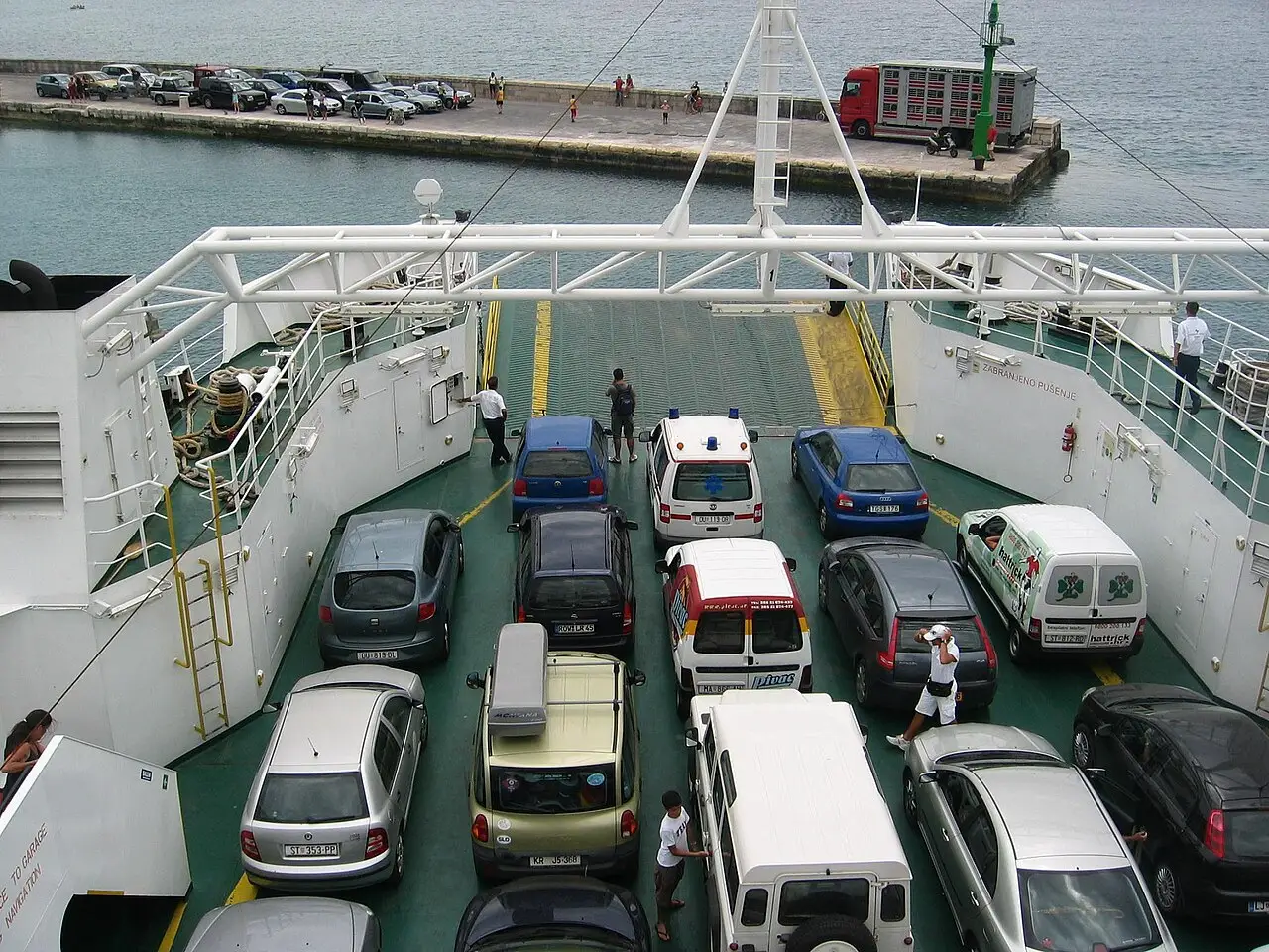 Cars parked on the open vehicle deck of a Croatian car ferry