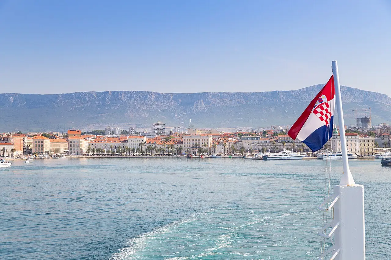 Ferries and the Croatian flag at the busy ferry port of Split