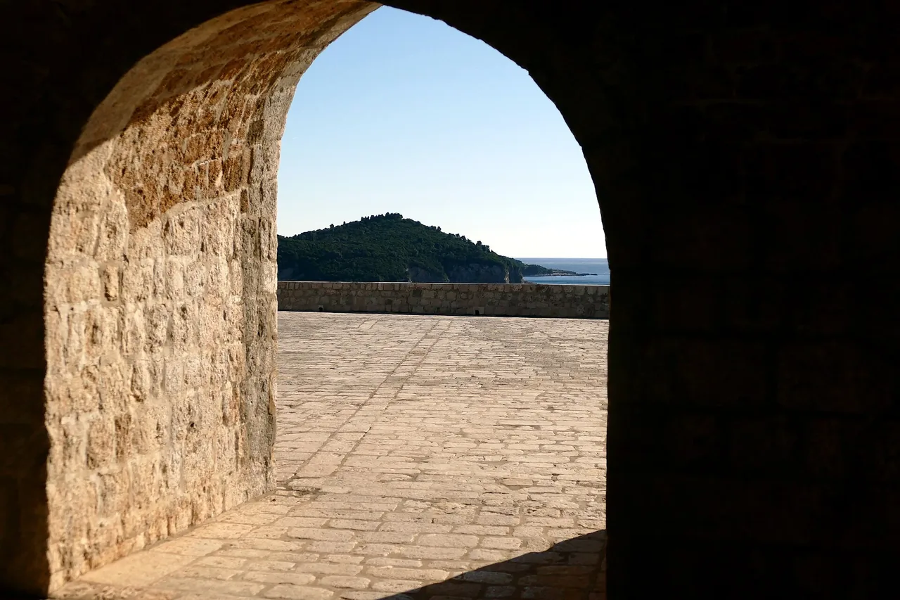 The open stone terrace of Fort Lovrjenac in Dubrovnik looking out to the island of Lokrum