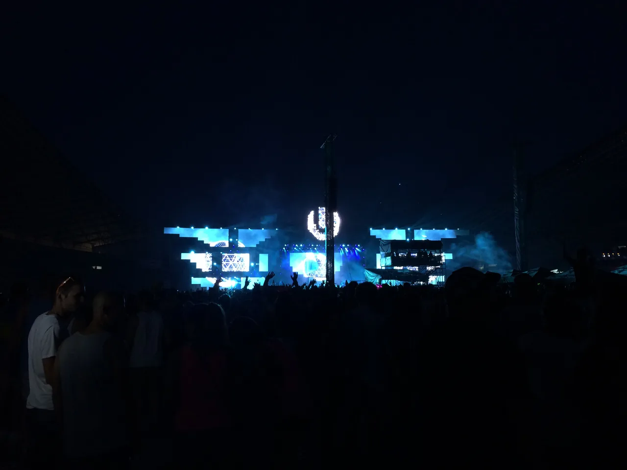 The main stage of Ultra Europe in Split lit up in blue at night, with a large festival crowd