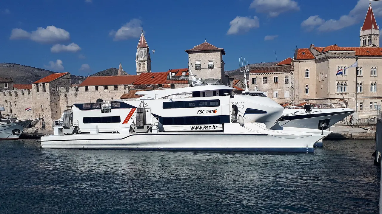 A KSC fast catamaran moored in front of the old stone town of Trogir on the Dalmatian coast