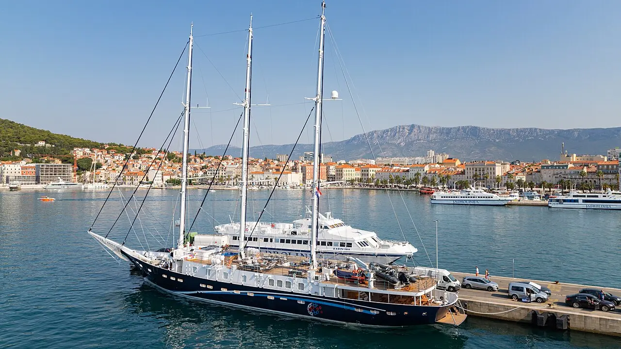 Fast passenger catamarans moored at the ferry port of Split with the city and hills behind