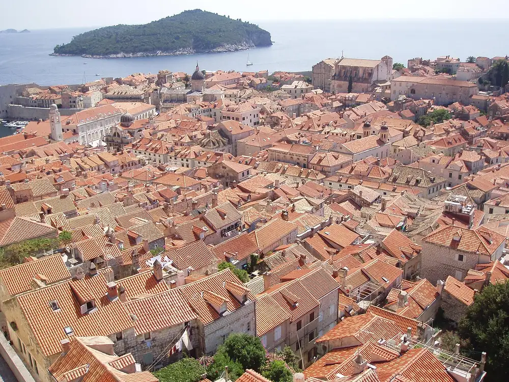 The terracotta roofs and city walls of Dubrovnik old town seen from the ramparts above