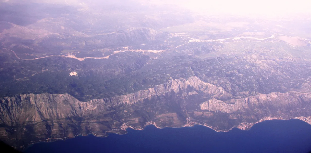 Green spring landscape below the Biokovo mountains on the Makarska Riviera