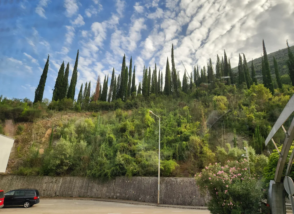The Croatia to Montenegro border crossing with a checkpoint building and road barriers
