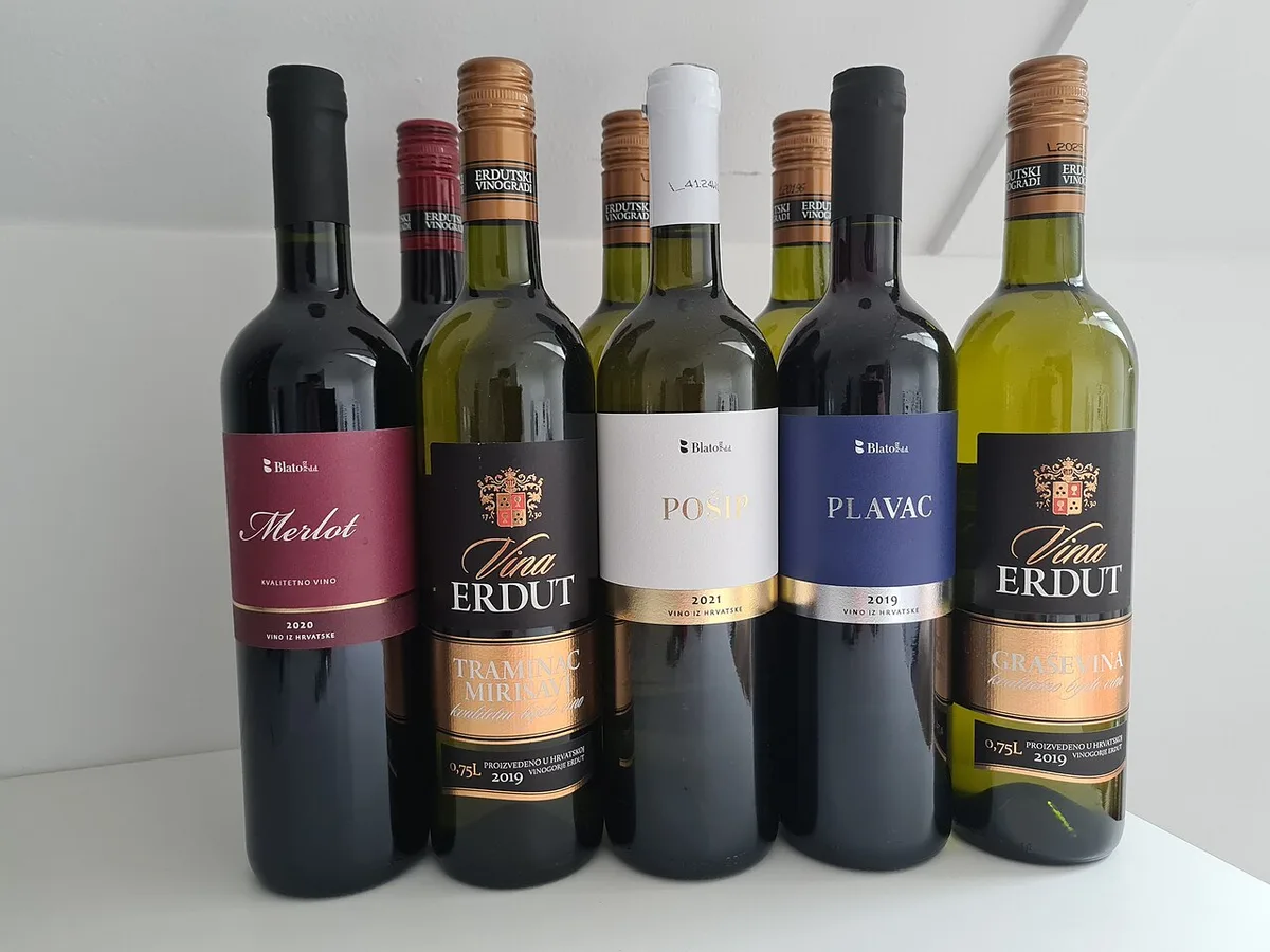 A selection of Croatian wine bottles lined up on a table