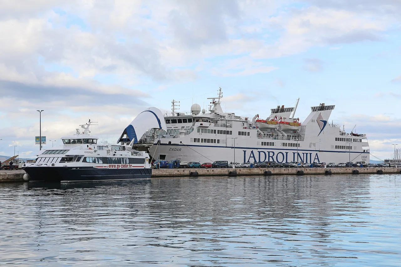 A white Jadrolinija car ferry berthed at Split, with cars and passengers on the quay