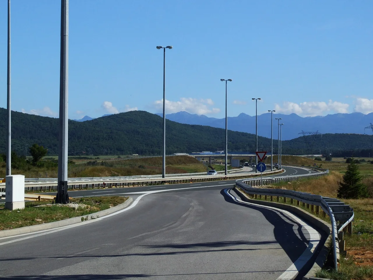 The A1 motorway running through green hills near Gospić in inland Croatia