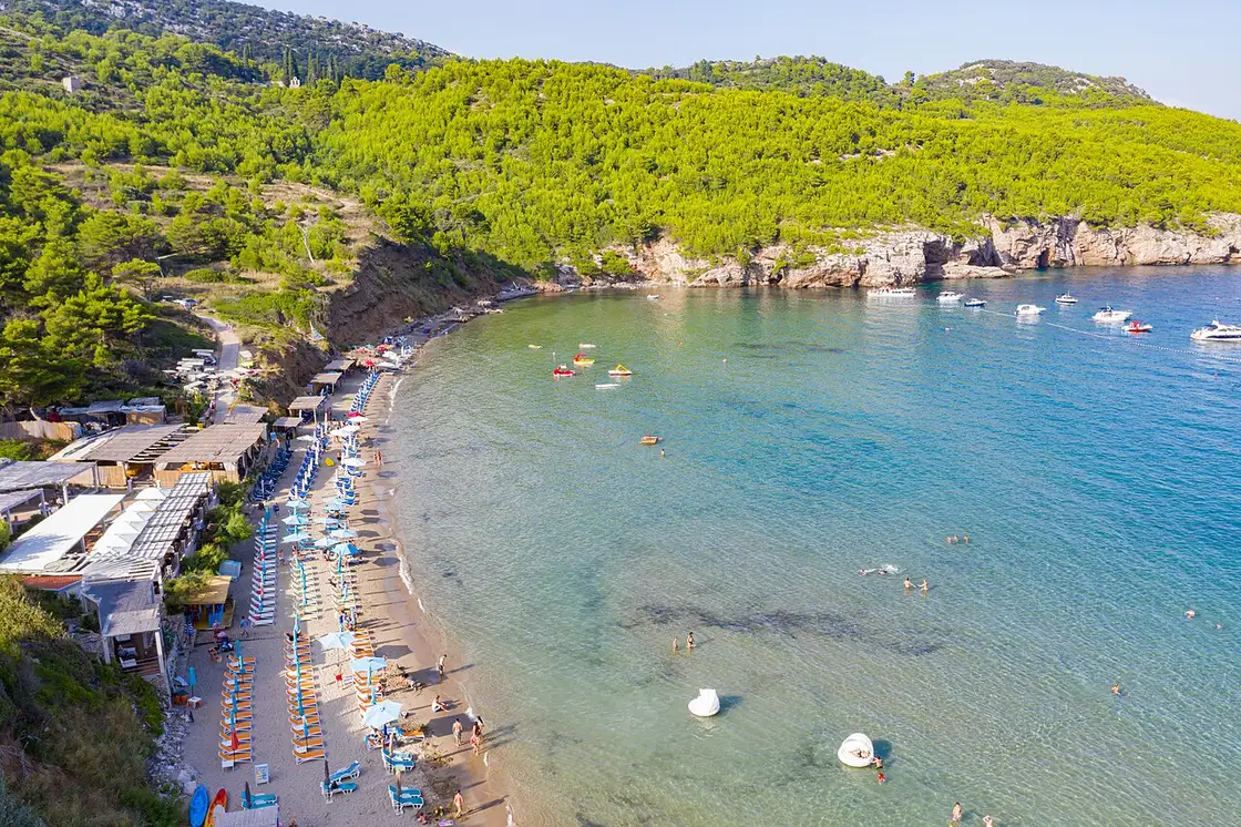 Sandy Šunj beach with turquoise water on Lopud in the Elaphiti Islands