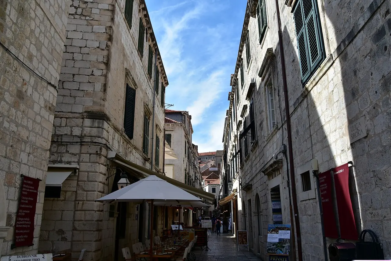 A narrow café-lined side lane in the Old Town of Dubrovnik