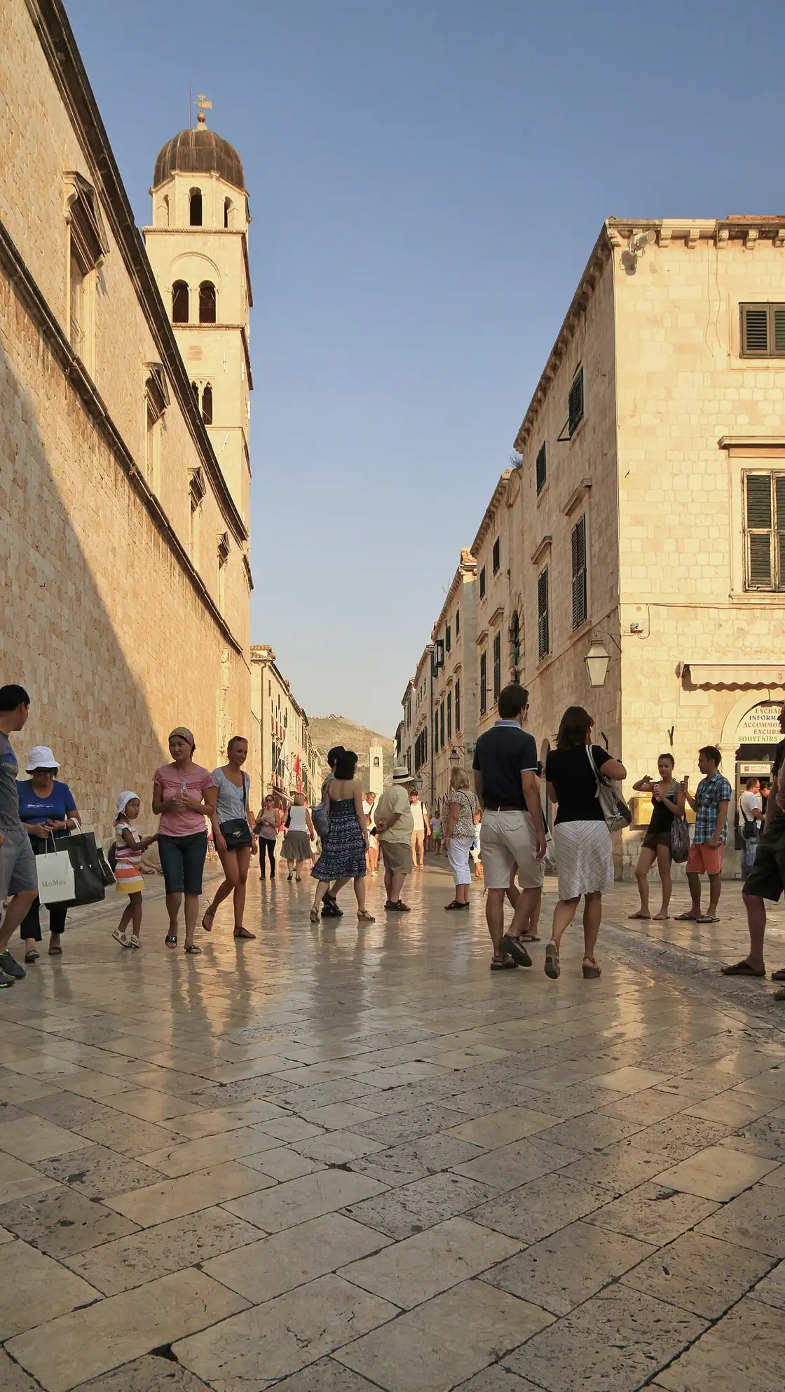 The Stradun in summer with the Franciscan bell tower and crowds