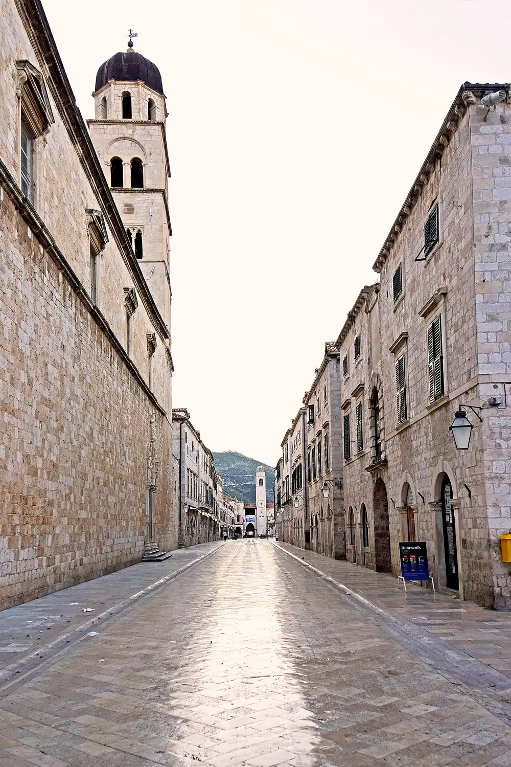 The Stradun main street of Dubrovnik at dawn with the Franciscan bell tower
