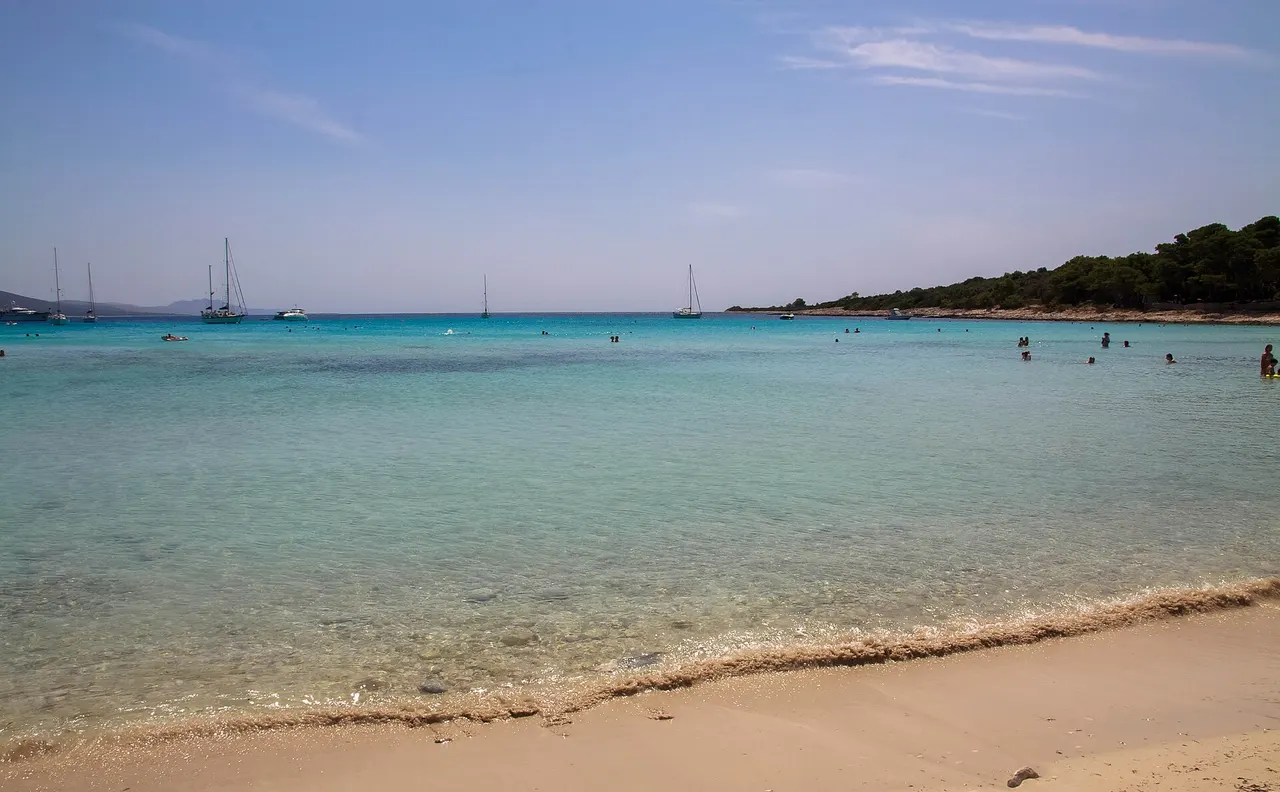 Aerial view of Sakarun bay on Dugi Otok with pale sand and clear turquoise water