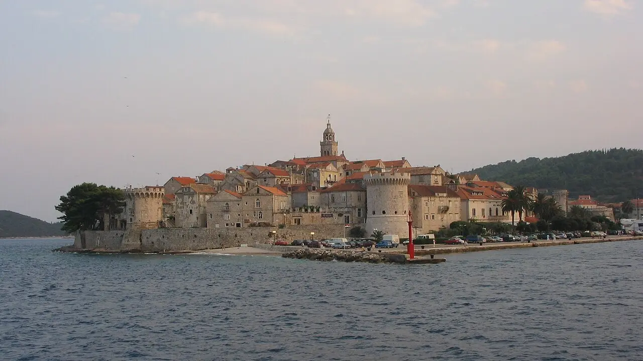 The walled old town of Korčula seen from the ferry approaching from Orebić across the narrow channel