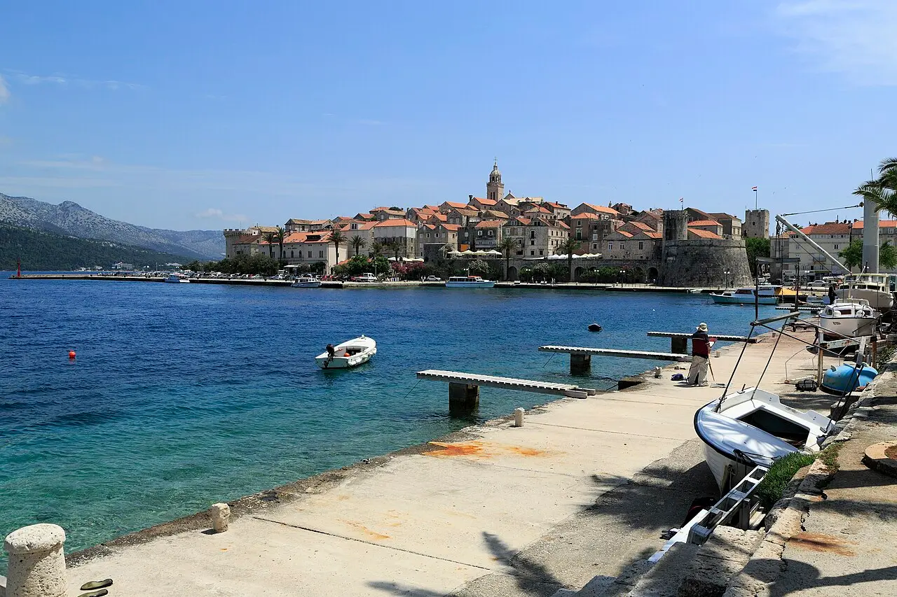 Korčula old town on its peninsula, stone walls and towers rising from the Adriatic