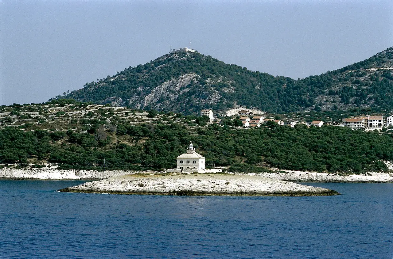 Pokonji Dol bay near Hvar Town with a small islet and clear Adriatic water