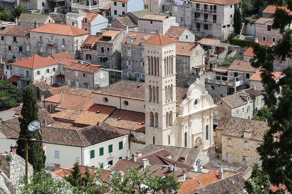 The bell tower of St Stephen's Cathedral rising above the terracotta roofs of Hvar Town