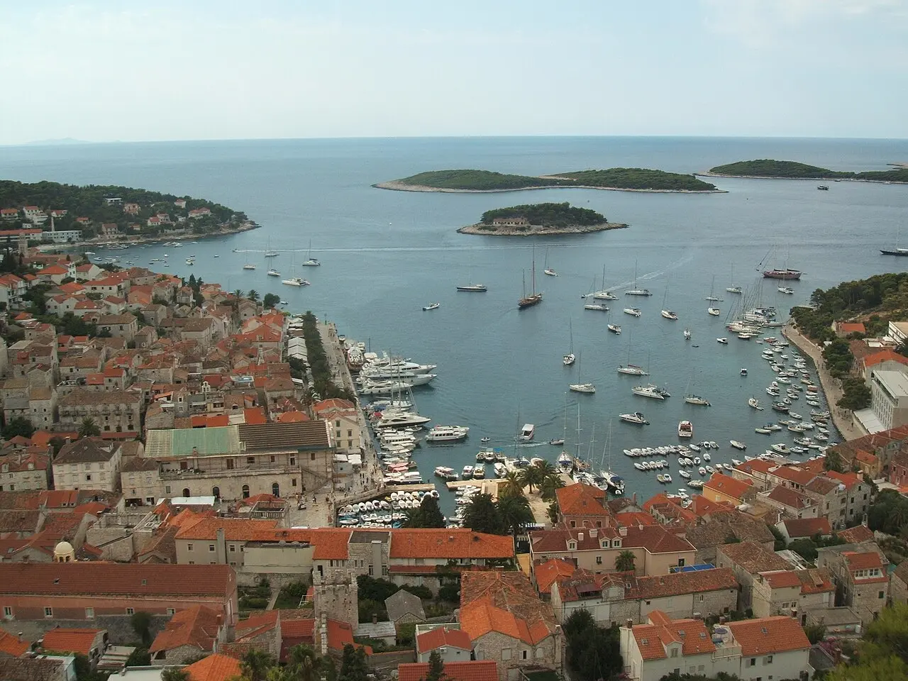 View down from the Spanish Fortress over Hvar Town's red roofs, the harbour and the Pakleni Islands