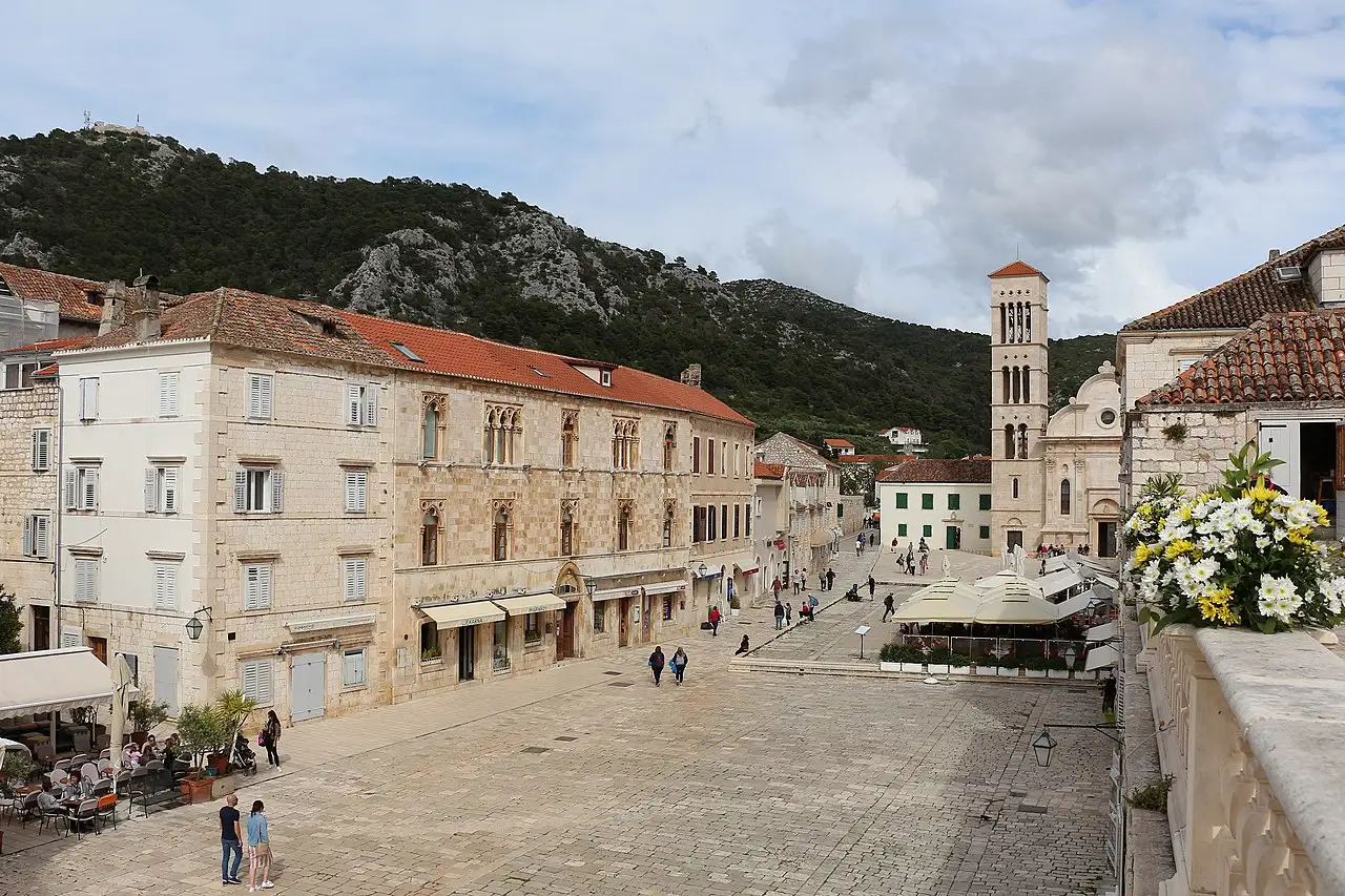 St Stephen's Square (Pjaca) in Hvar Town, a long stone plaza leading to the cathedral and bell tower