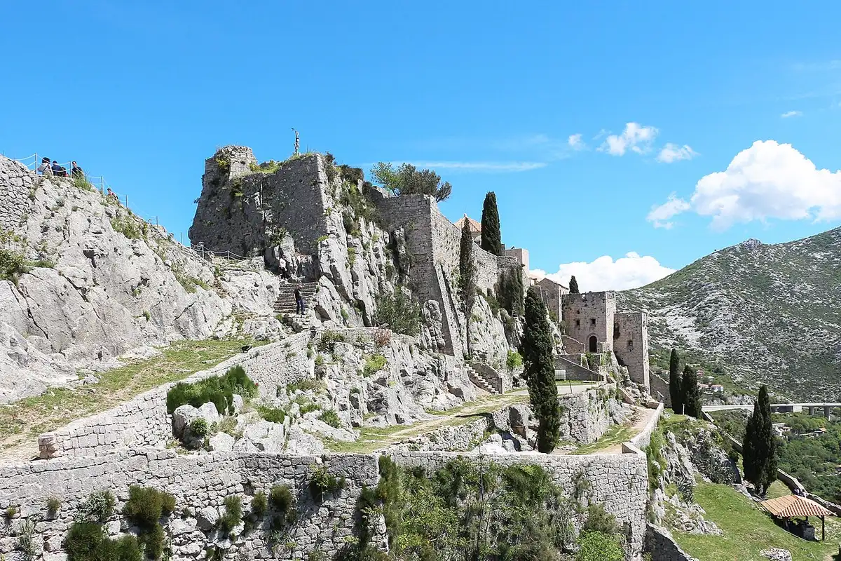 Inner stone courtyard and fortified buildings inside Klis Fortress
