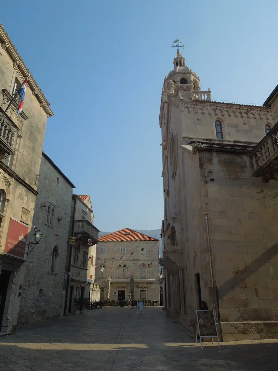The stone Cathedral of St Mark on the main square of Korčula old town, with its tall Gothic-Renaissance bell tower