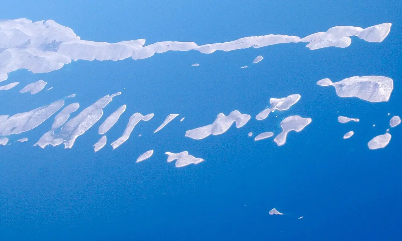 High aerial view of the long, thin, bare Kornati islands strung out across deep blue Adriatic sea
