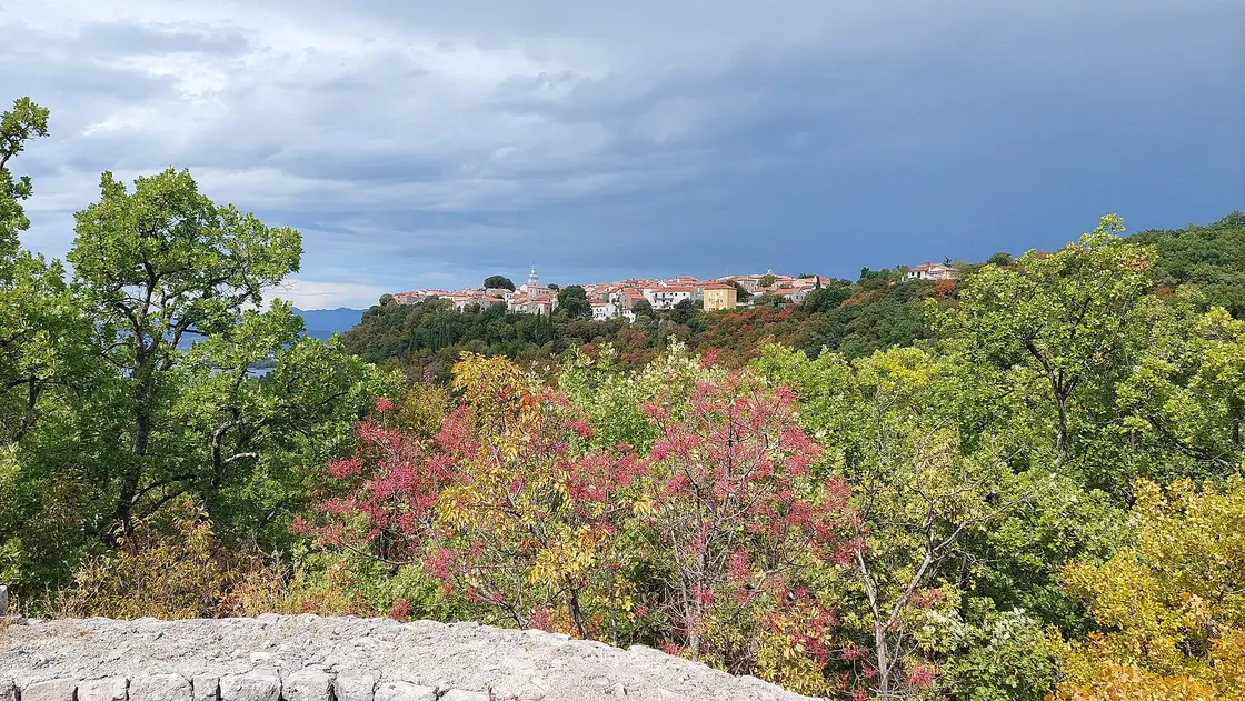 The old town of Omisalj on a ridge above the bay in the north of Krk in autumn colours