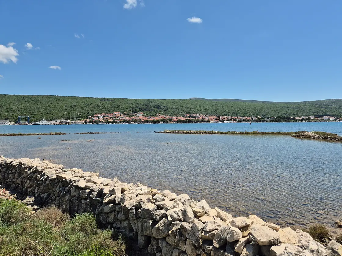 The enclosed bay of Puntarska Draga on Krk with Punat and its marina across the water