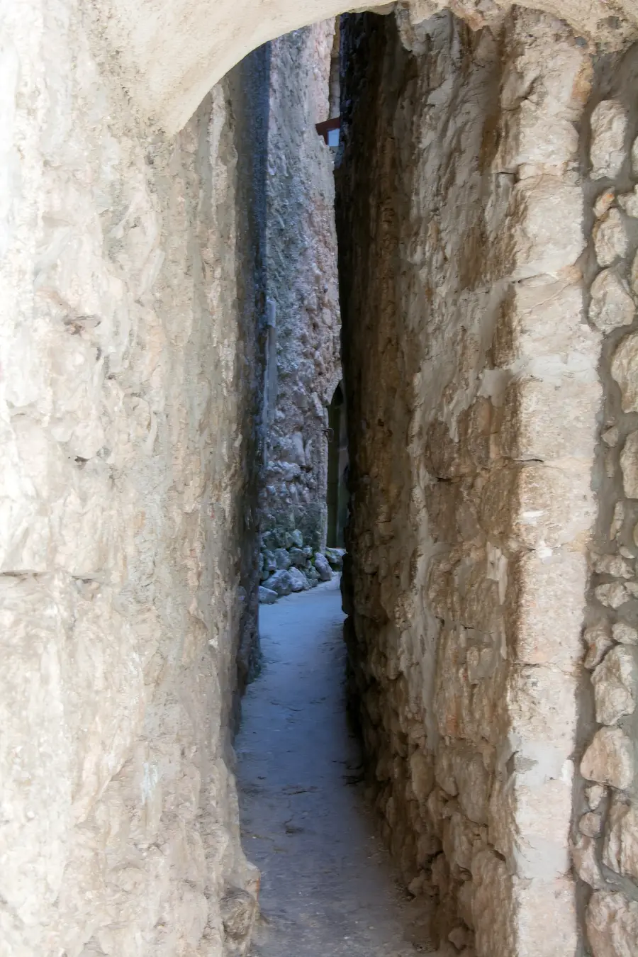 A very narrow stone alley in the old town of Vrbnik on Krk