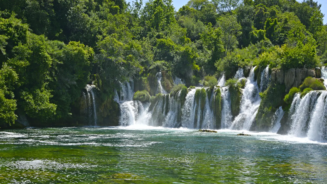 The wide Skradinski Buk cascades at Krka National Park seen from water level