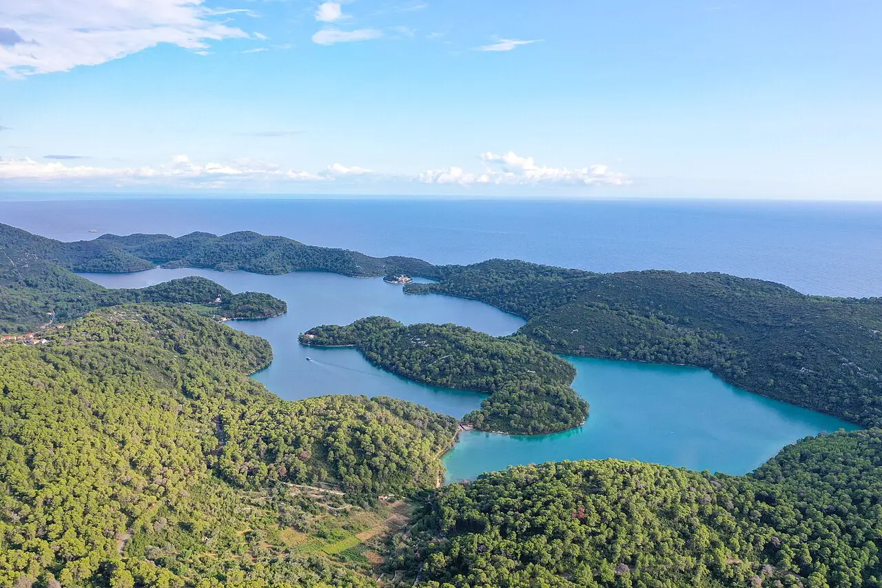 Aerial view of the two saltwater lakes Veliko Jezero and Malo Jezero in the forested western third of Mljet island