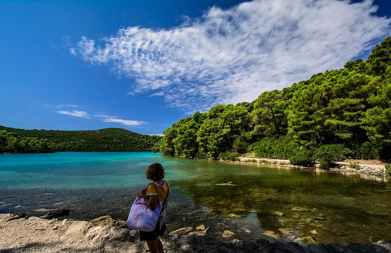 A swimmer in the clear calm water of Malo Jezero, the small lake in Mljet National Park