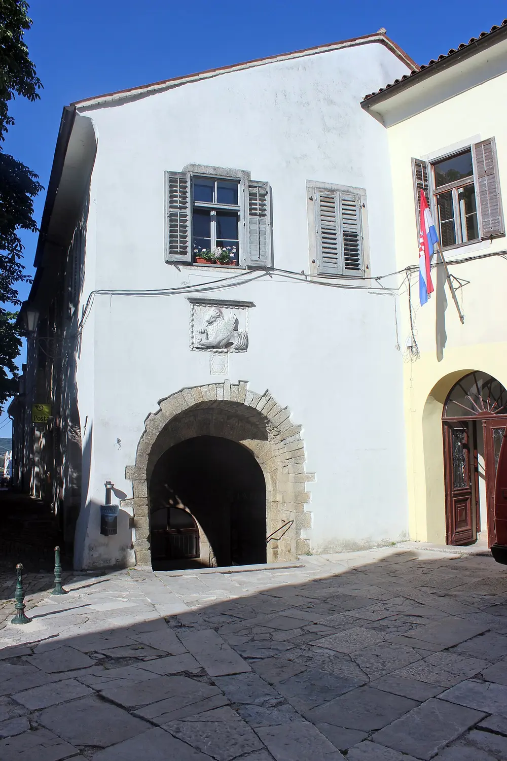 Stone castle gate and archway at the entrance to Motovun old town