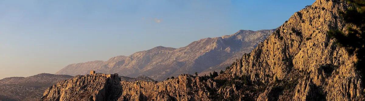 Wide ridge view toward Fortica Starigrad above Omiš and the coast
