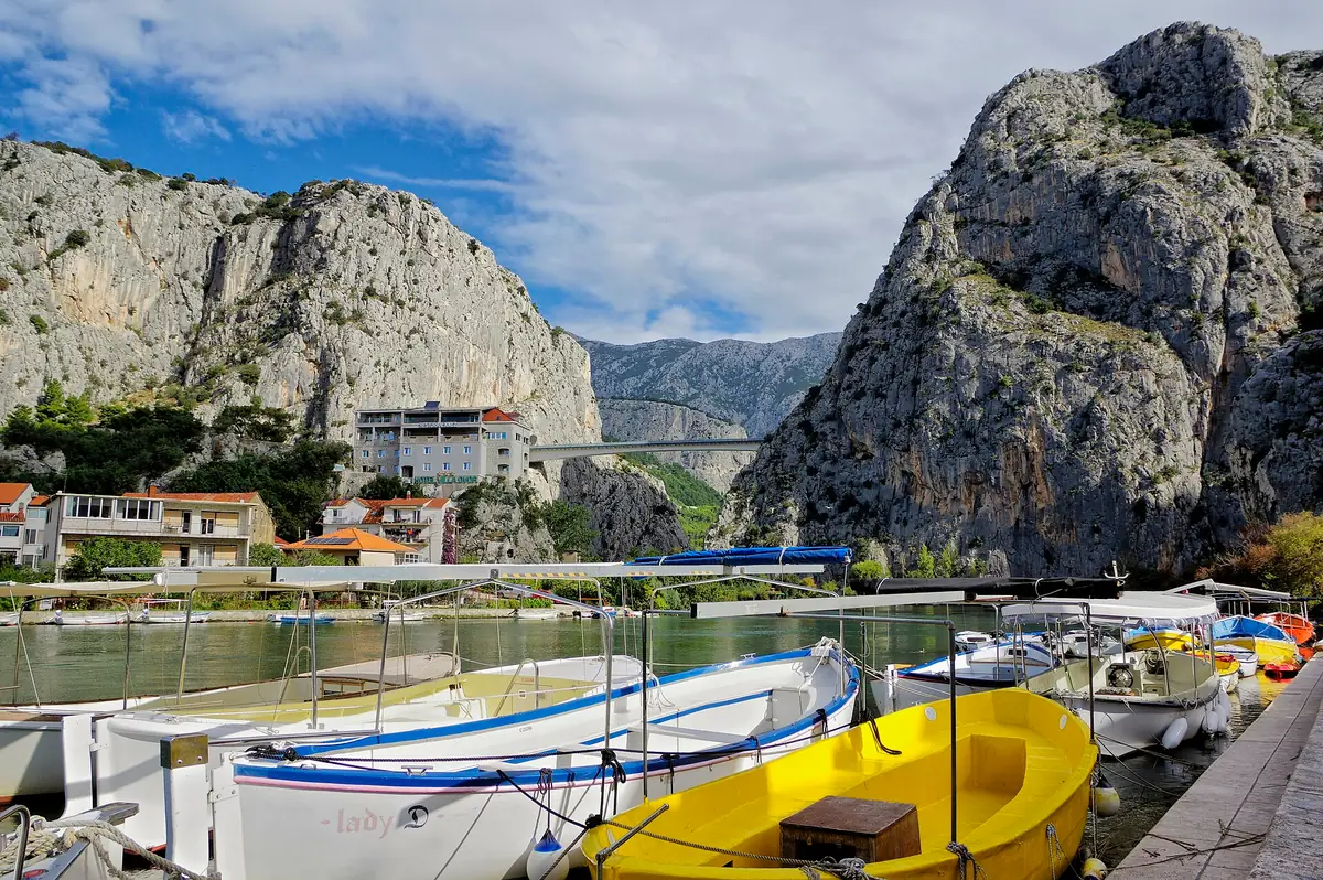 Terracotta rooftops of Omiš packed under the limestone ridge
