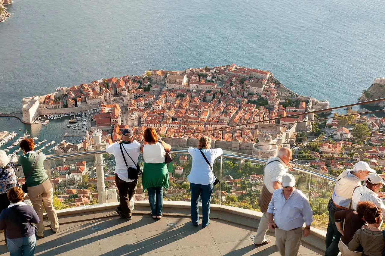 People at the Mount Srd viewing terrace looking down over Dubrovnik Old Town and the Adriatic Sea
