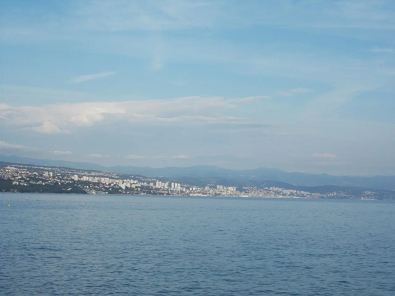 Tree-shaded curve of the Lungomare path above the sea at Opatija
