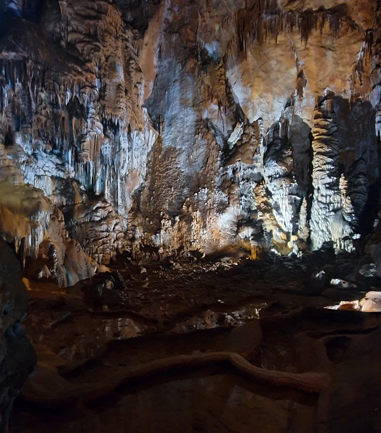 Illuminated stalactites and stalagmites inside Manita Peć cave in Paklenica National Park