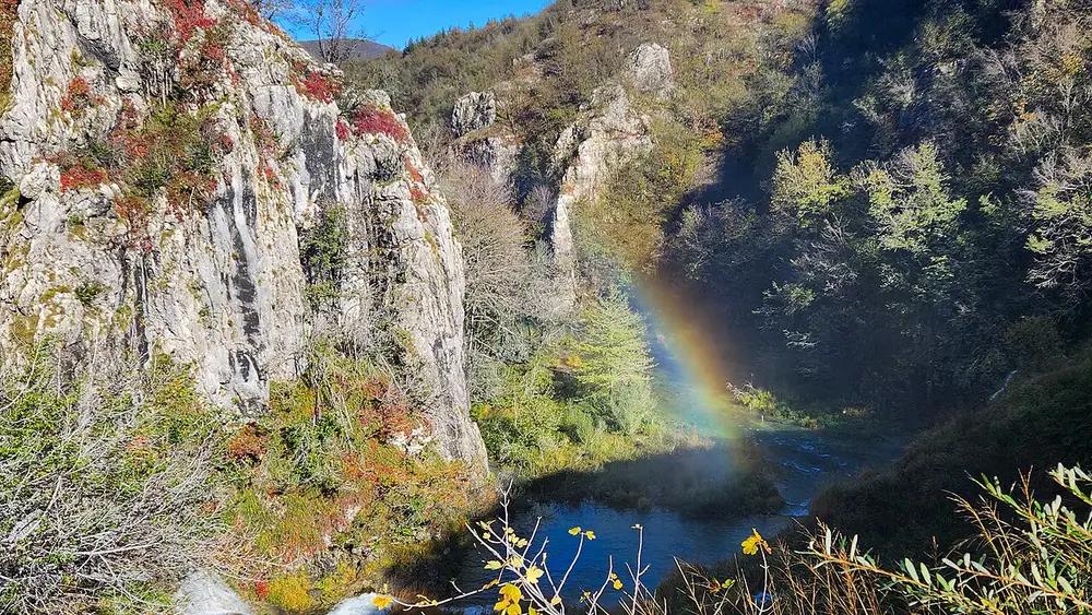 A rainbow in the spray of a waterfall at Plitvice Lakes