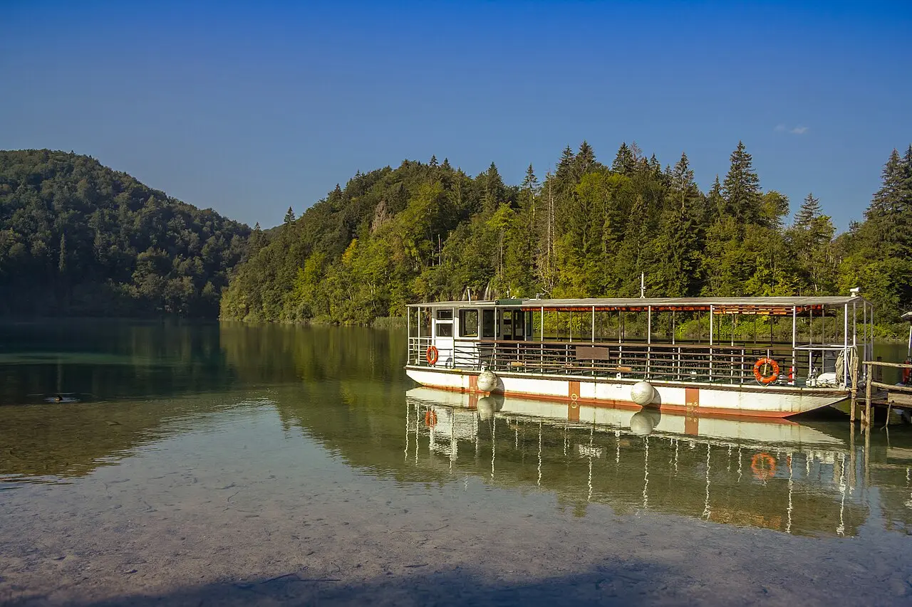 A panoramic electric ferry on calm Lake Kozjak at Plitvice Lakes
